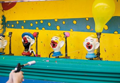 Shooting clown heads at the fairground