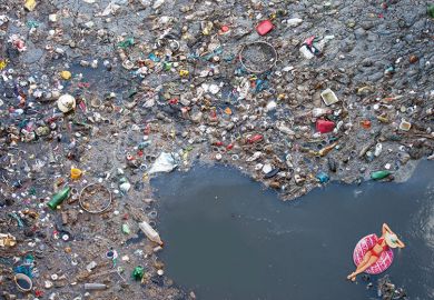 Montage of woman floating in sea of rubbish