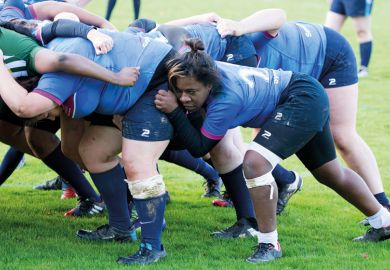 Female rugby player in scrum