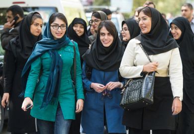 Female students walking on campus, University of Tehran, Iran