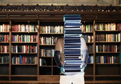 figure holding stack of books
