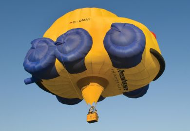 Flying hot-air balloon shaped as car, Rhineland-Palatinate, Germany Flying hot-air balloon shaped as car, Rhineland-Palatinate, Germany