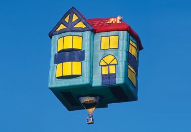 Flying hot air balloon shaped like house