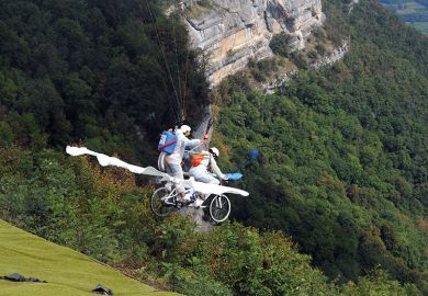 Paragliders compete on their “tandem bicycle” in Saint-Hilaire du Touvet, France, 2012, illustrating entrepreneurship