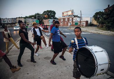 Children dancing in street, following a drummer Children dancing in street, following a drummer
