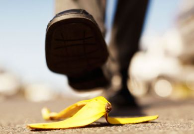 Foot about to step on banana peel