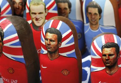 Portraits of Manchester United footballers Wayne Rooney, Cristiano Ronaldo and Ryan Giggs on traditional Russian “matreshka” nesting dolls in Moscow