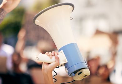 A megaphone held aloft, symbolising free speech