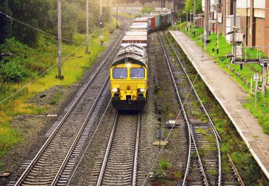 Freight train moves through the Trafford station from the port. Manchester. England. 