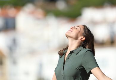 A woman breathes fresh air