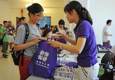 A freshman registers in New York University Shanghai (NYU Shanghai), east China, Shanghai.