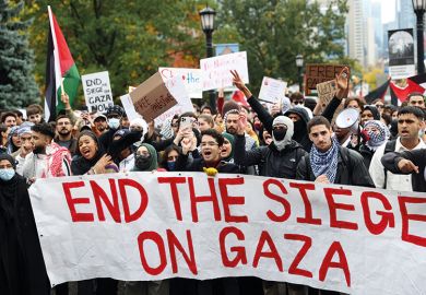 Protesters, mostly university students, gather to protest against Israeli airstrikes in Gaza, at Queen's Park outside the Legislative Assembly of Ontario in Toronto, Canada to illustrate Can campus debate about Gaza be civil?