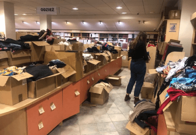 A woman sorts through donations for Ukraine at the University of Gdansk A woman sorts through donations for Ukraine at the University of Gdansk