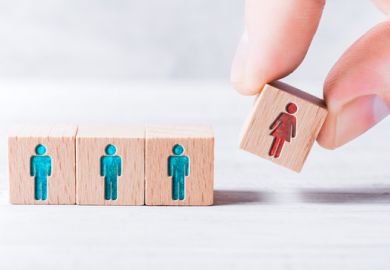 A cube with a woman on it being added to three with men on them, symbolising gender equality