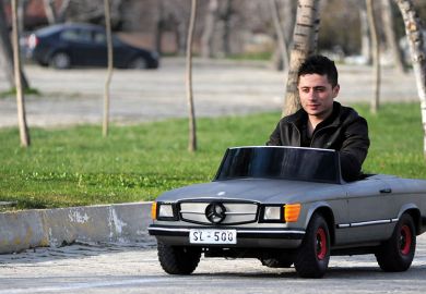 Man driving small car Man driving small car