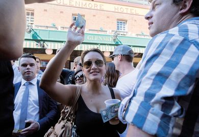 Woman holds Australian dollar notes