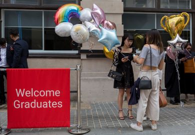 Friends and family of Hillary Chung, a 21 year-old Law graduate from Hong Kong, celebrate her graduation with a 2:1 degree outside the London School of Economics