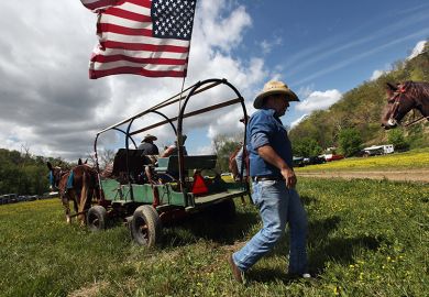 Wagon with stars and stripes flag. USA.