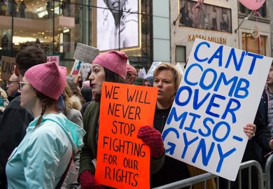 Participants at the Women's March in New York City on January 21, 2017. The placard at centre refers to US President Donald Trump and reads: 'Can't comb over misogyny'