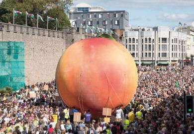 Giant peach being moved through Cardiff streets