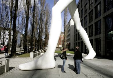 Giant statue stands over crowd
