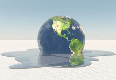 Globe melting into puddle of water Globe melting into puddle of water