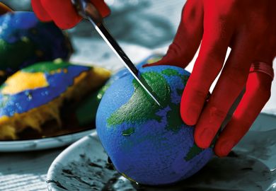 Cutting an orange painted like a globe representing funding cuts