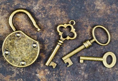 Golden keys to an open gold padlock, symbolising gold open access