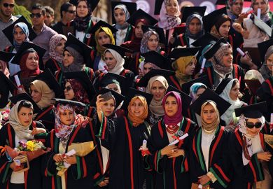 Libyan pharmacy students pose for a selfie during their graduation ceremony at the Al-Arab University in Benghazi, 2016
