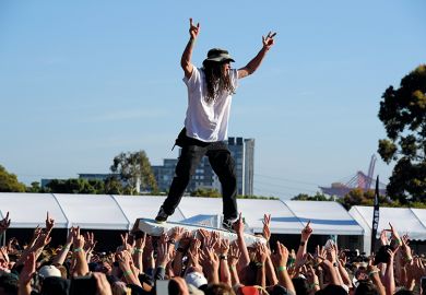 Crowd surfing at the Good Things Festival, Melbourne, Australia to illustrate ‘Overarching’ missions ‘boost research efficiency’