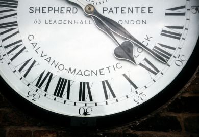 Greenwich, London, UK - July 15th 2006 Fragment of the Galvano-Magnetic clock (Sephered) in the wall of Greenwich Observatory, with 24-hour and Roman numerals.