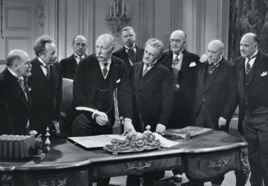 Group of old men signing paperwork
