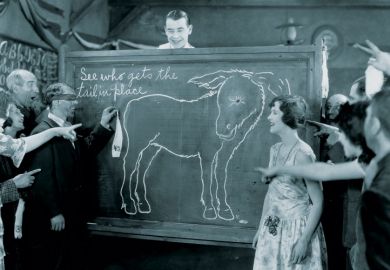 Group playing pin the tail on the donkey