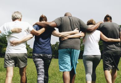 Group of people hugging in the park
