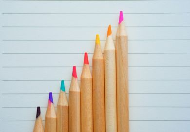 growth graph with pencils on paper