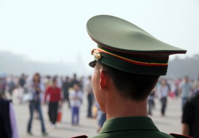 Guardian Officer at Tiananmen Place, China illustrating surveillance of international students