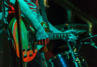 An electric guitar and drums