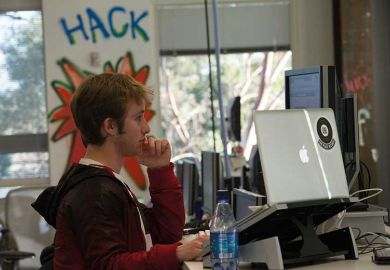 hacker-using-two-screens hacker-using-two-screens