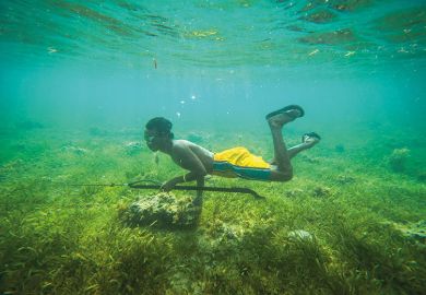 Boy hunting underwater Boy hunting underwater