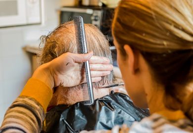 woman give elderly man haircut woman give elderly man haircut