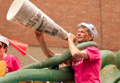 Halifax, Nova Scotia, Canada - July 23, 2011 A man dressed in a sailor's outfit yells and smiles to the crowds in the 24th annual Pride Parade through the heart of the city. Halifax has the fourth largest Pride Parade in Canada and is renowned for its fam