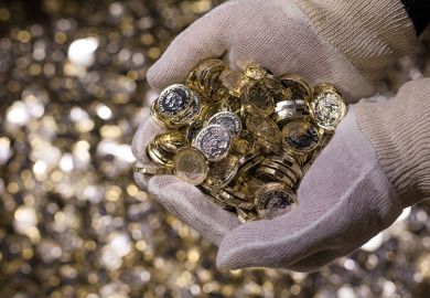 Hand full of pound coins