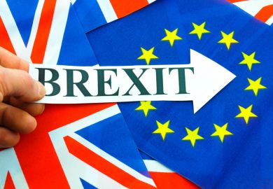 Hand holding Brexit sign, EU referendum Hand holding Brexit sign, EU referendum