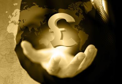 Hand holding UK pound currency symbol against world map