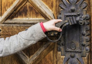 Hand opening old door