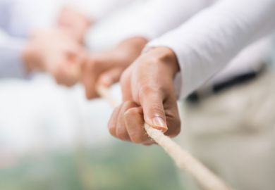 Hands pulling rope, tug of war, teamwork Hands pulling rope, tug of war, teamwork