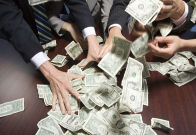 Hands grabbing dollar bills