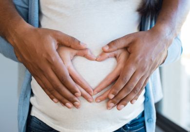 Hands on pregnant tummy