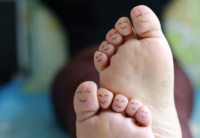 Smiley faces drawn on toes Smiley faces drawn on toes