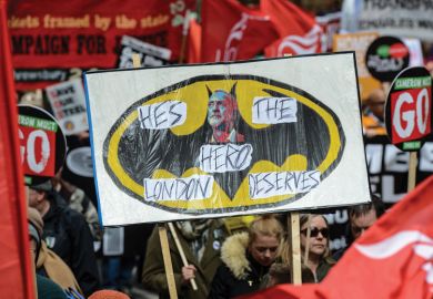 Health, Homes, Jobs and Education demonstrators hold Jeremy Corbyn placard, London